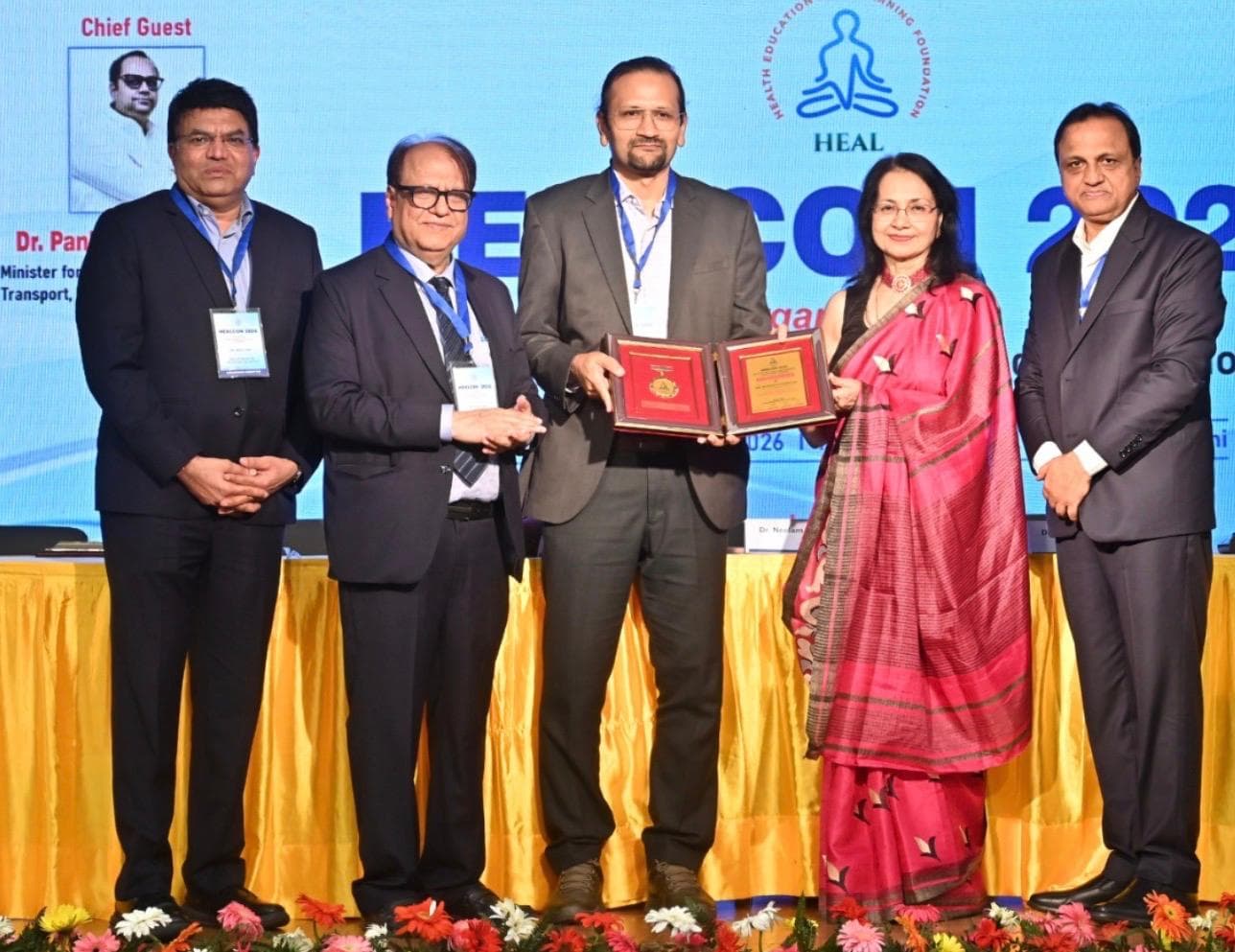 Group photo on stage after the award presentation at HEALCON 2026
